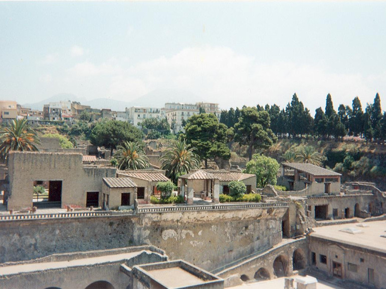 The archeological site of Ercolano. In the background the modern town and Mount Vesuvius