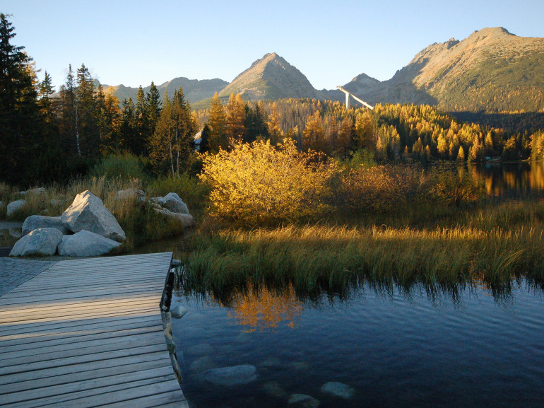 small bridge in Strbske Pleso with panoramatic view of Tatra Mountains 